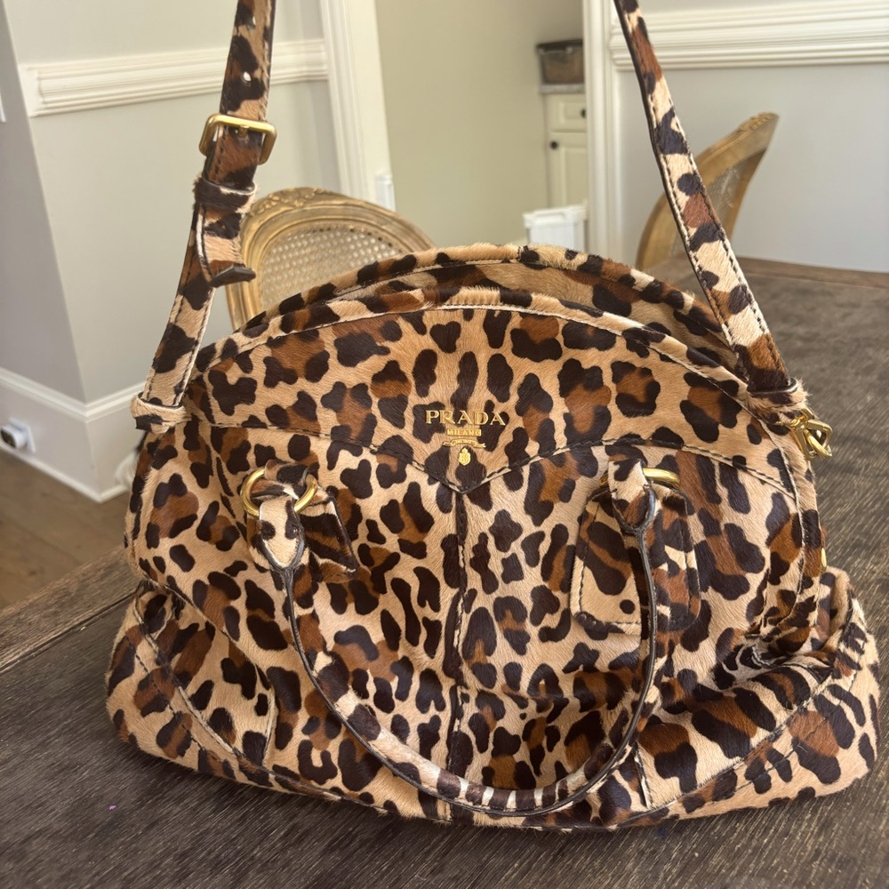 Prada Fur Leopard Cheetah print travel bag! Gorgeous gold hardware details!